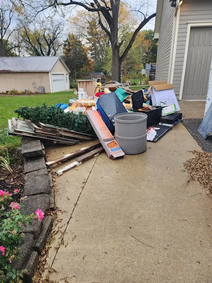 Dumpster being loaded with debris for Commercial Dumpster Rental in Whitesboro